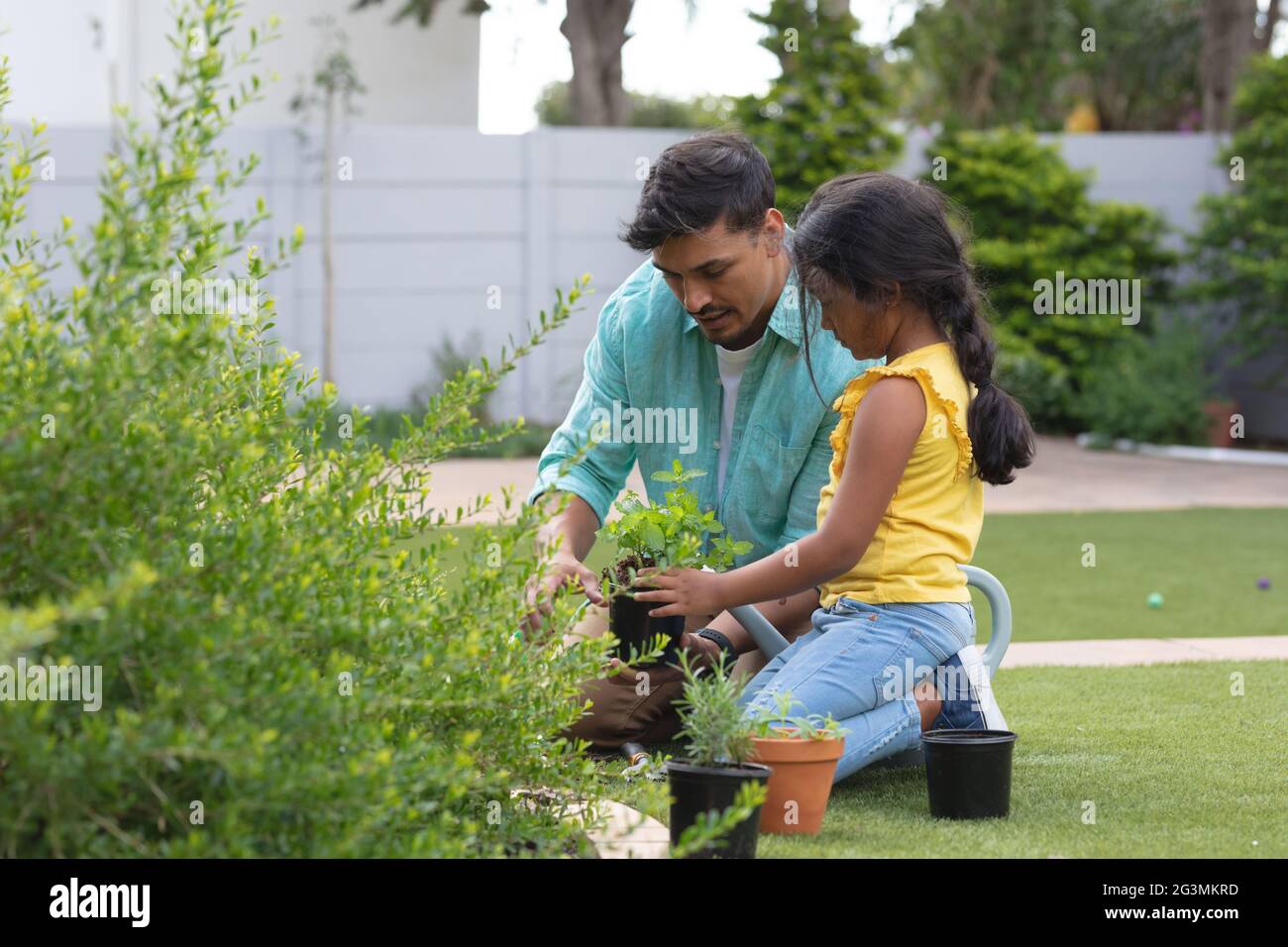 Kid planting hispanic hi-res stock photography and images - Alamy