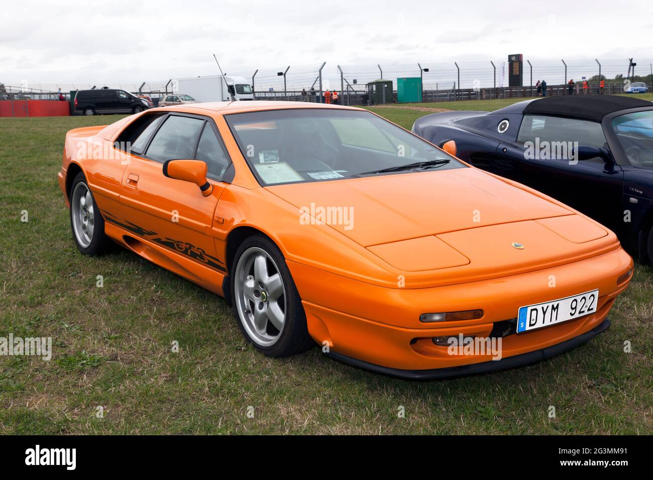 Three-quarters front view of an 1996, Orange, Lotus Esprit GT3, on display, at the 2017 Silverstone Classic Stock Photo