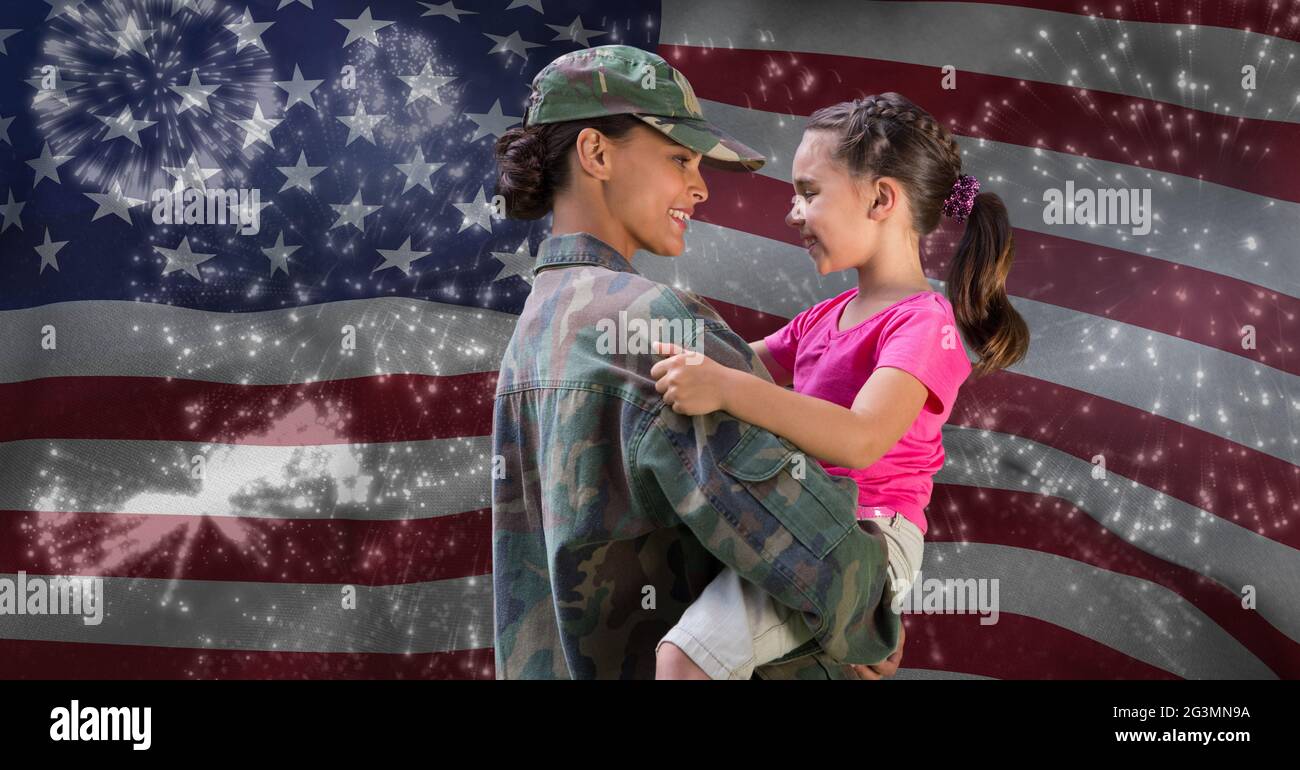 Composition of female soldier with her daughter over american flag andr fireworks Stock Photo