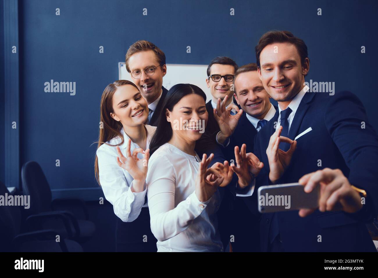 Three successful smiling people hi-res stock photography and images - Alamy