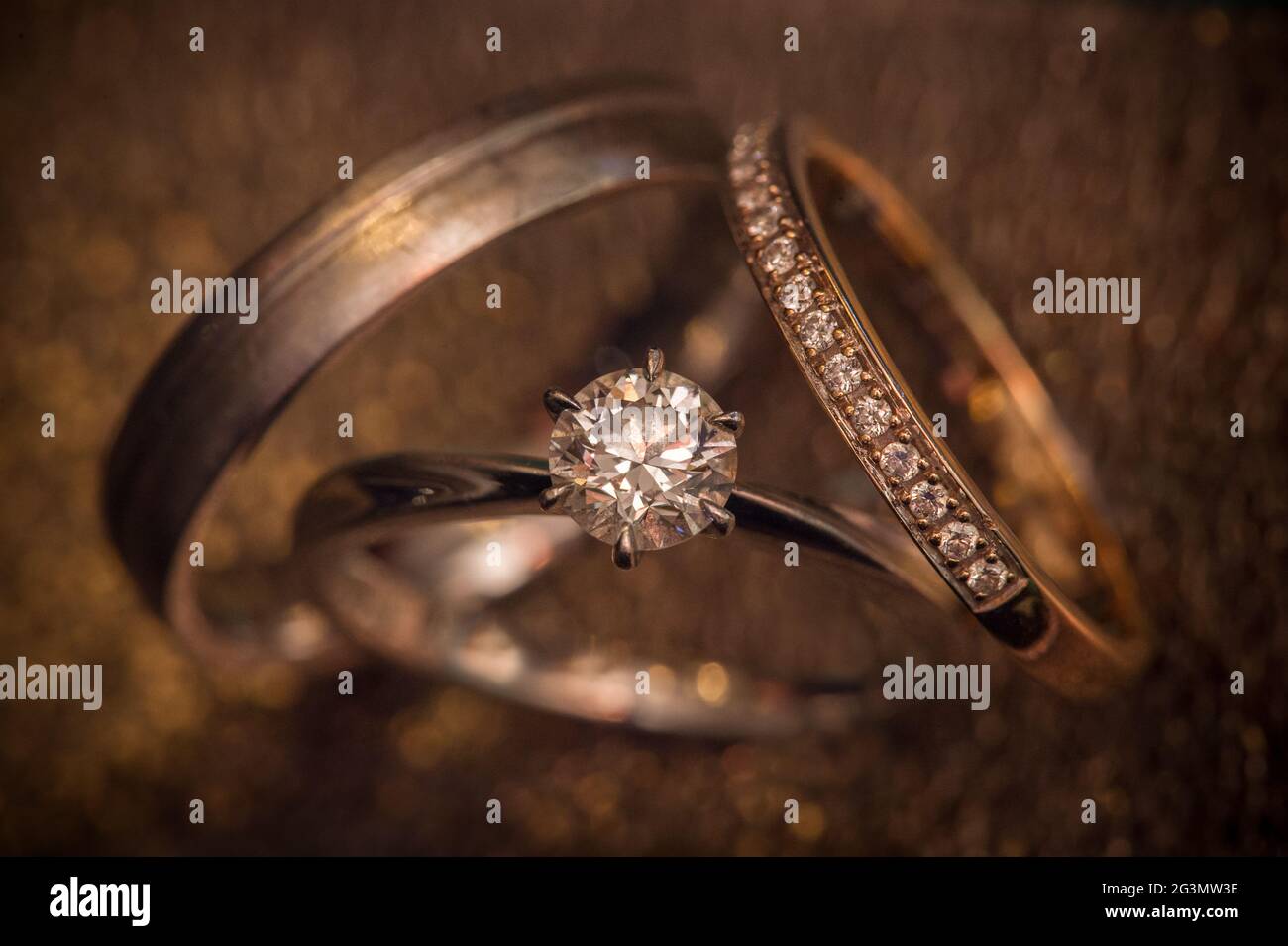 Wedding bands and engagement ring Stock Photo Alamy