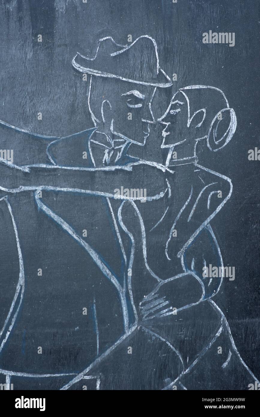 Drawing with chalk of a pair of dancers on the blackboard. Graphic concept of community recreational activity in Mexico. Vertical screen Stock Photo