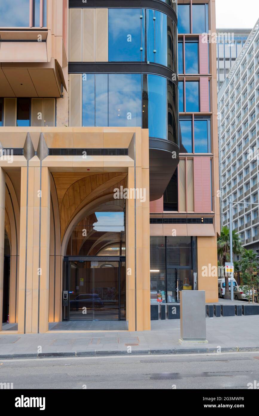 Close to the stonework of St Marys Cathedral, St James Church and Hyde Park Barracks is the new glass and stone facade King and Phillip Apartments. Stock Photo