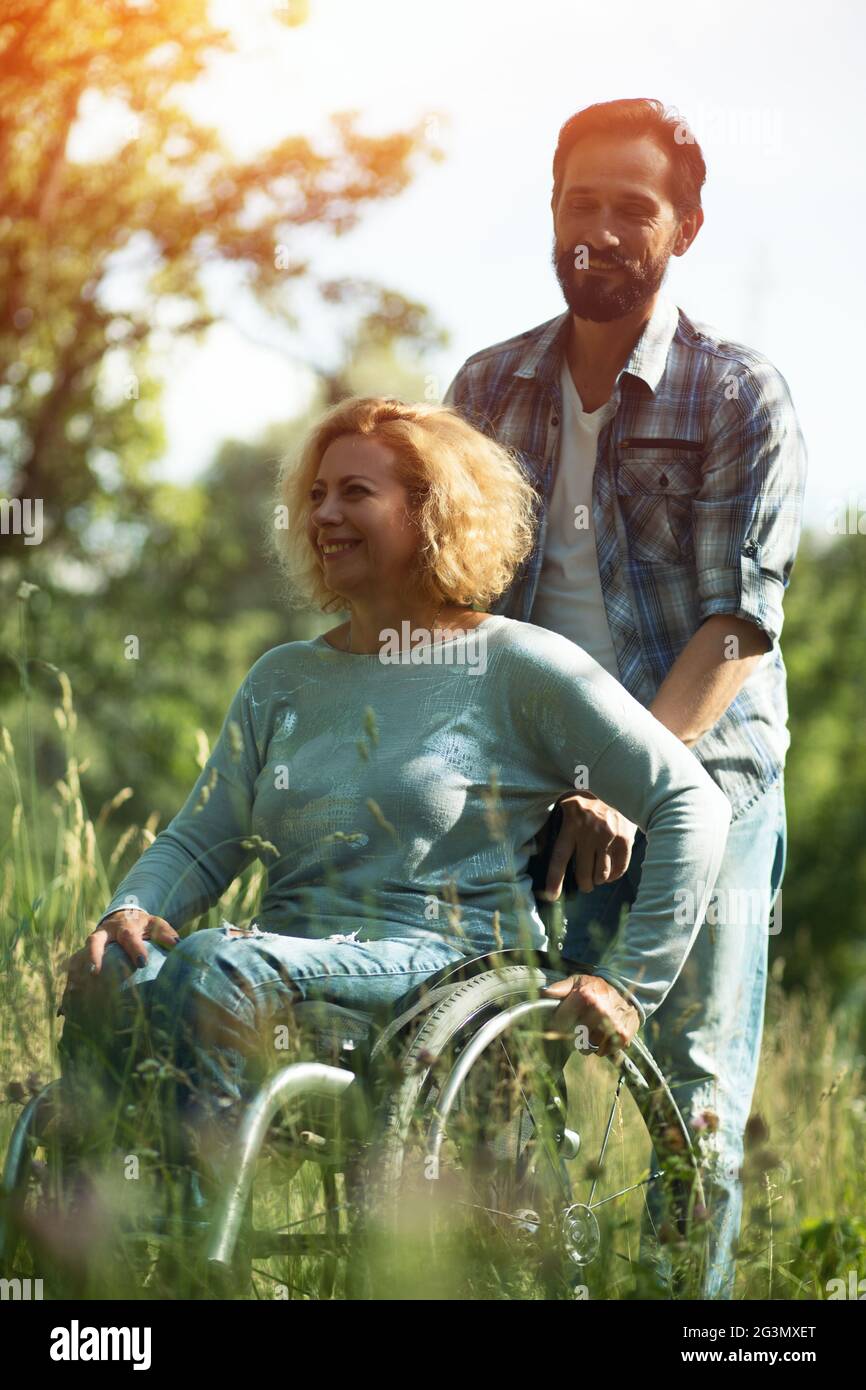 Couple wheelchair young hi-res stock photography and images
