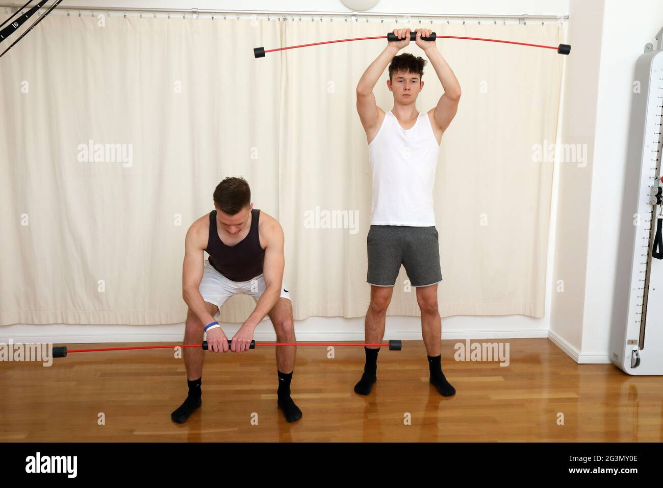 "22.11.2020, Berlin, , Germany - Patients in a physiotherapy practice exercising with swinging bars. 00S201122D376CAROEX.JPG [MODEL RELEASE: YES, PROP Stock Photo