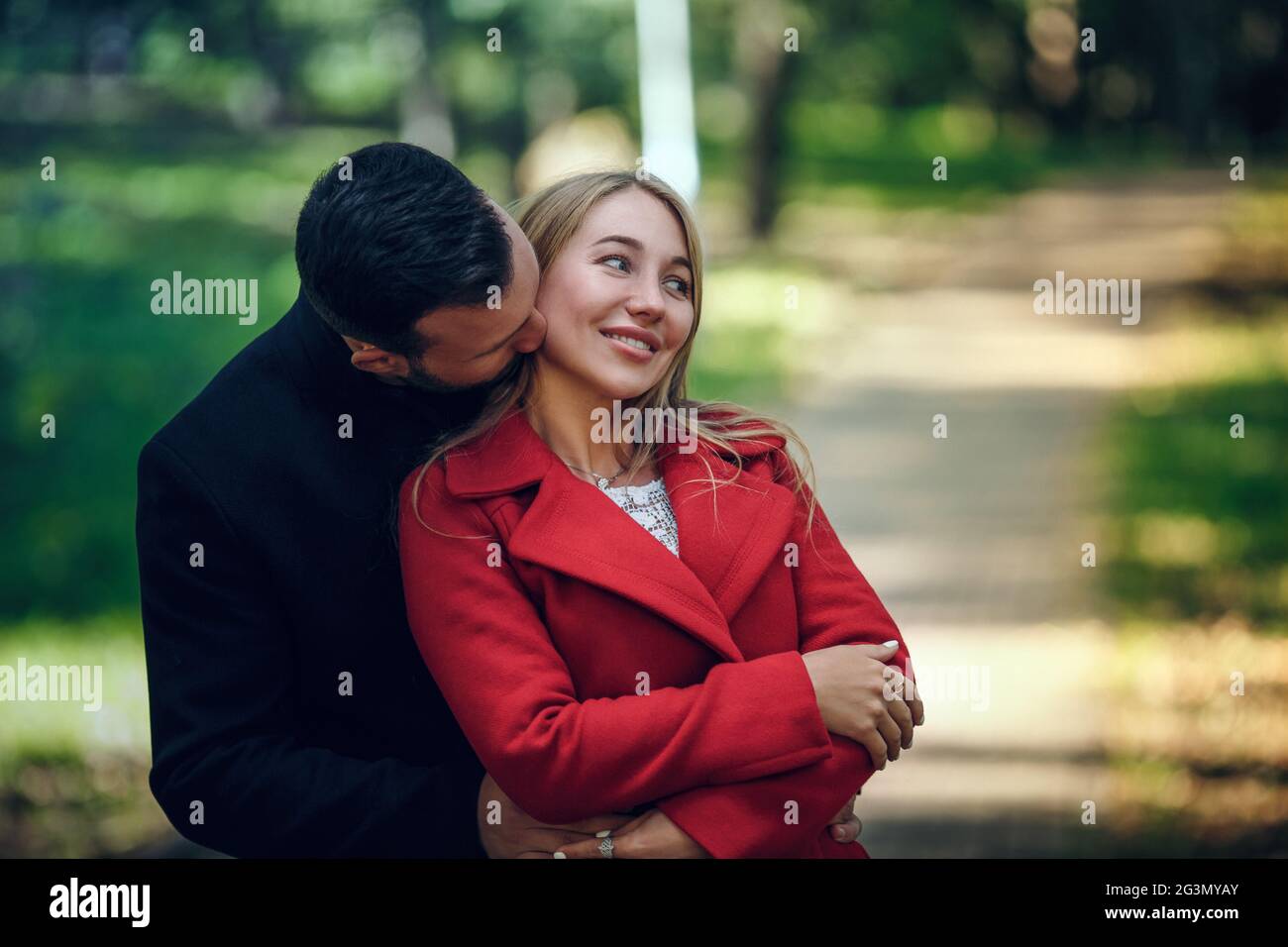 Couple walking hand in park Stock Photo - Alamy