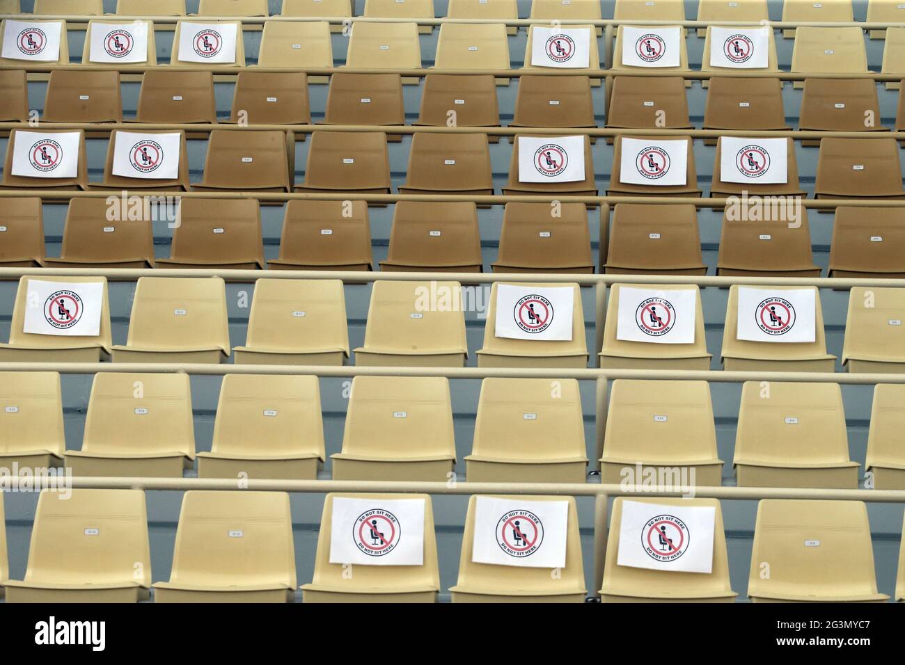 '20.02.2021, Riad, Riyadh, Saudi Arabia - Seats in a grandstand are marked and partially blocked for safety distance due to the corona pandemic. 00S21 Stock Photo