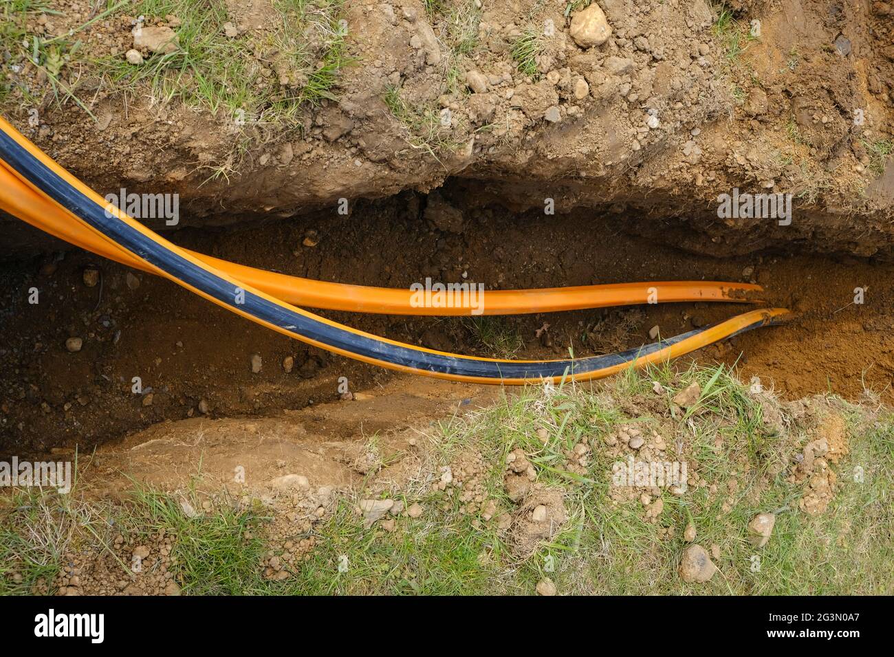 '16.04.2021, Rheinbach, North Rhine-Westphalia, Germany - Internet broadband expansion, construction site laying of fibre-optic cables, new constructi Stock Photo