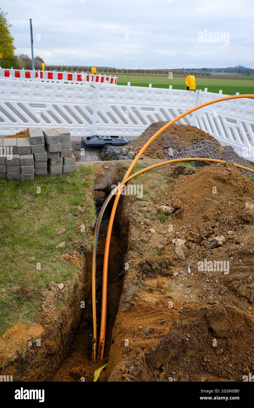 '16.04.2021, Rheinbach, North Rhine-Westphalia, Germany - Internet broadband expansion, construction site laying of fibre optic cables, new constructi Stock Photo