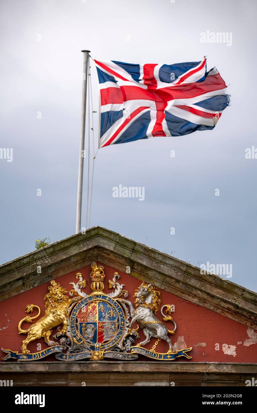 Fort George, Inverness, Scotland, UK. 13 June 2021. Pictured: Union Jack flag flying in the wind seen at Fort George with the Fort George crest which reads, HON SOIT QUI MAL Y PENSE, DIEU ET MON DROIT. Scenes from Fort George.  Credit: Colin Fisher/CDFIMAGES.COM Stock Photo