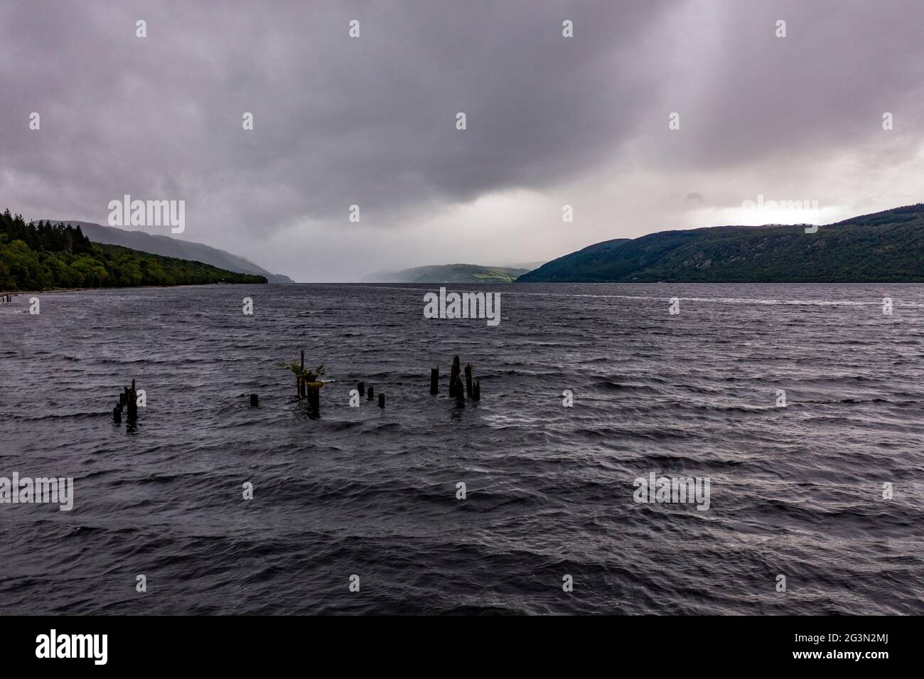 Loch Ness, Scotland, UK. 13 June 2021. Pictured: Drone aerial photography view from above of Loch Ness looking down the Great Glen towards Urquhart Castle. Loch Ness is famous for the Loch Ness Monster AKA Nessie.  Credit: Colin Fisher/CDFIMAGES.COM Stock Photo