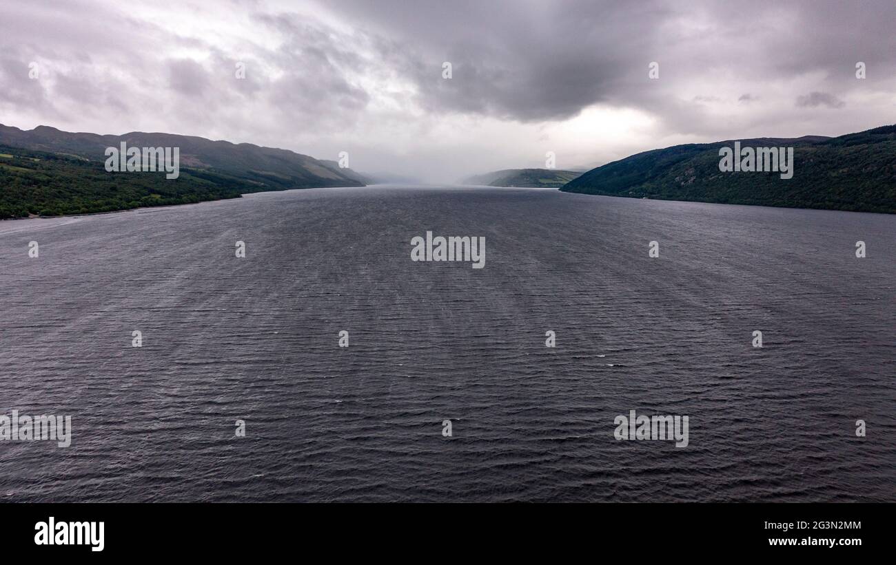 Loch Ness, Scotland, UK. 13 June 2021. Pictured: Drone aerial photography view from above of Loch Ness looking down the Great Glen towards Urquhart Castle. Loch Ness is famous for the Loch Ness Monster AKA Nessie.  Credit: Colin Fisher/CDFIMAGES.COM Stock Photo