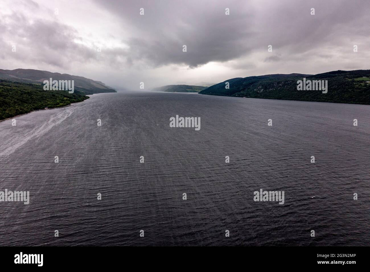 Loch Ness, Scotland, UK. 13 June 2021. Pictured: Drone aerial photography view from above of Loch Ness looking down the Great Glen towards Urquhart Castle. Loch Ness is famous for the Loch Ness Monster AKA Nessie.  Credit: Colin Fisher/CDFIMAGES.COM Stock Photo