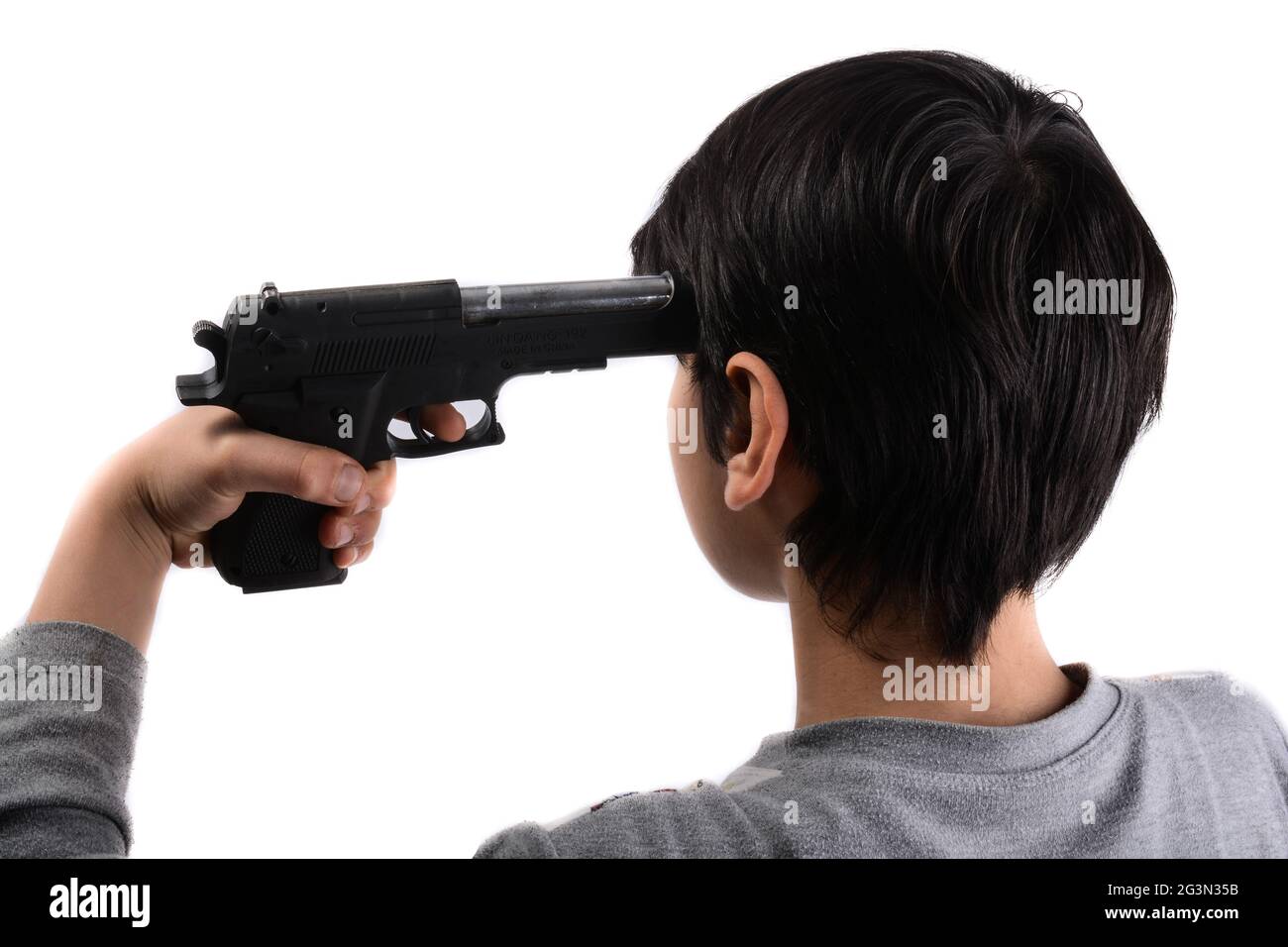 Gun in hand pointing to head Stock Photo Alamy