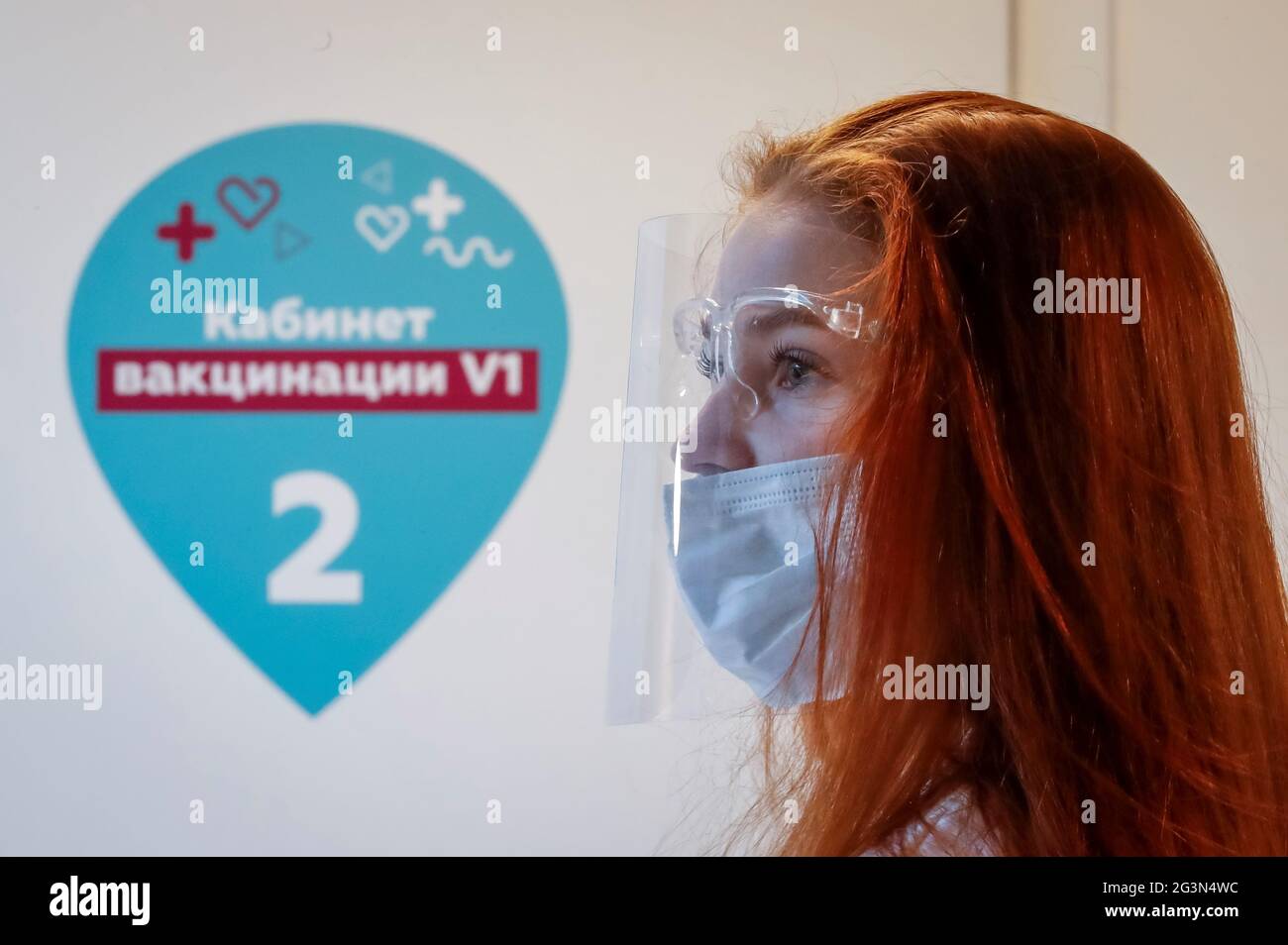 A volunteer looks on at a vaccination centre in Depo food mall in Moscow, Russia June 17, 2021.  REUTERS/Shamil Zhumatov Stock Photo