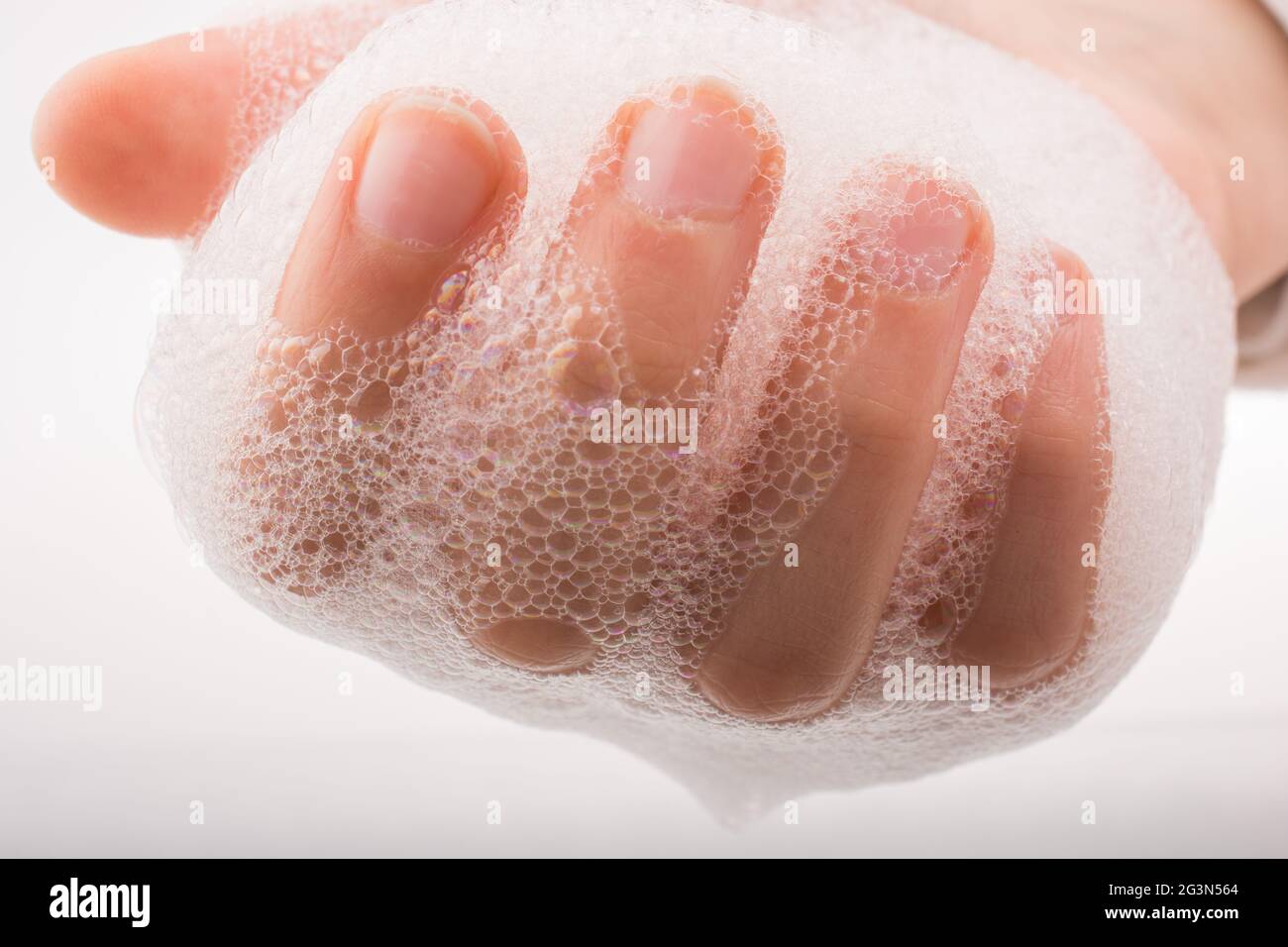 Child washing hands  in foam Stock Photo