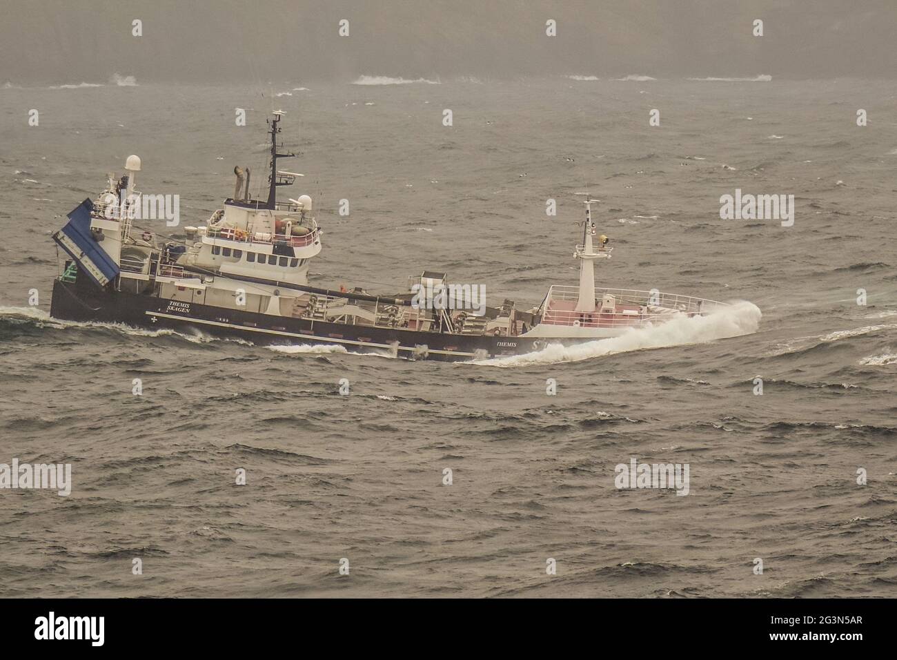 Fishing Trawler in heavy seas Stock Photo