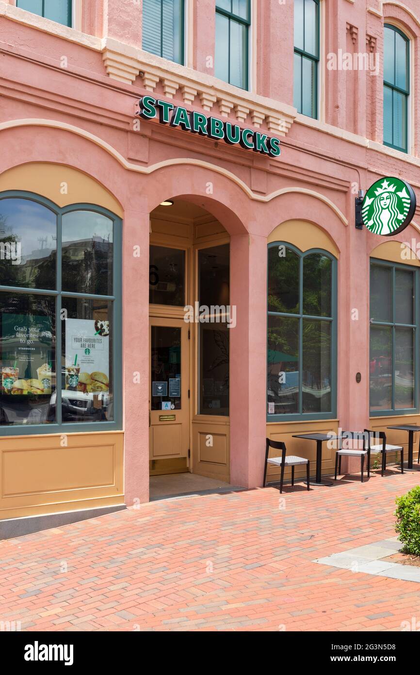SPARTANBURG, SC, USA-13 JUNE 2021: A Starbucks coffeeshop on Main at Spring St. Closet shot of entrance, windows, sign and logo. Vertical image. Stock Photo