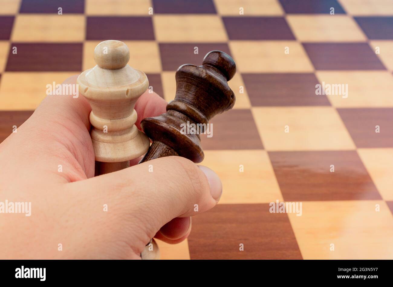 Person playing chess game making a move Stock Photo - Alamy