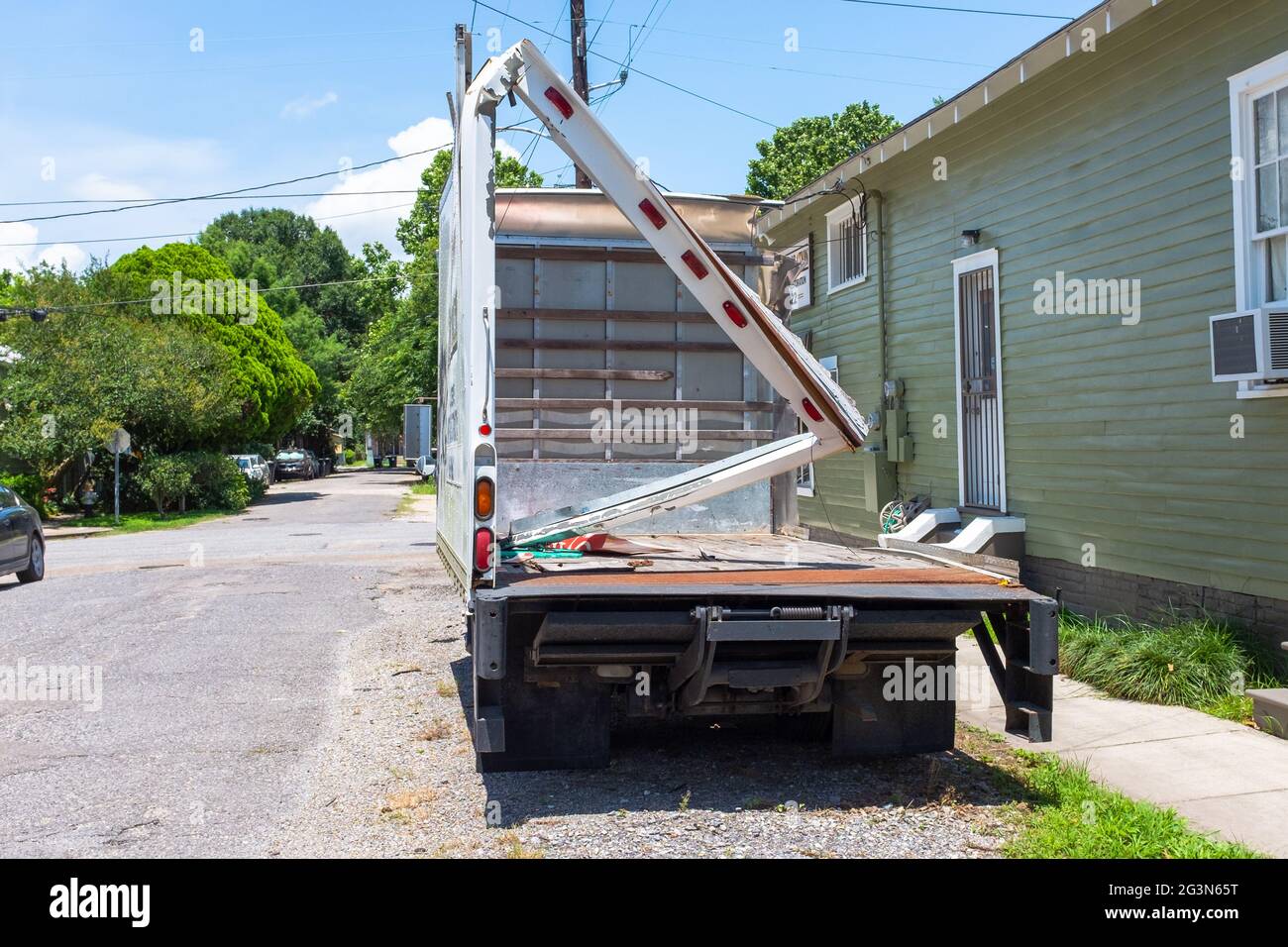 NEW ORLEANS, LA, USA - June 10, 2021: Severely damaged box truck with top, back and sides torn off. Stock Photo