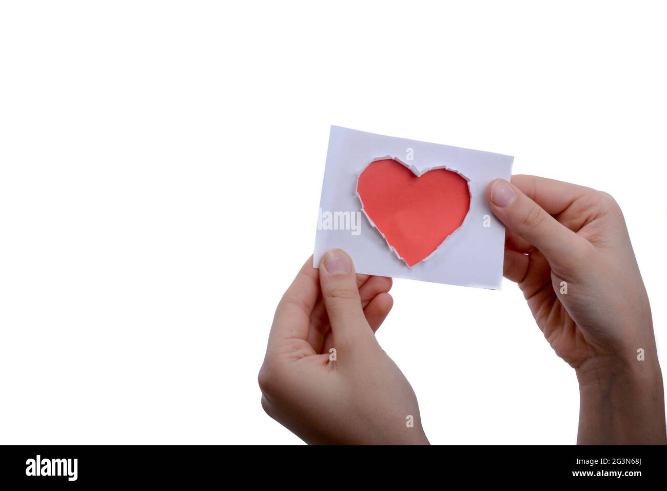 Red heart shape paper in hand Stock Photo