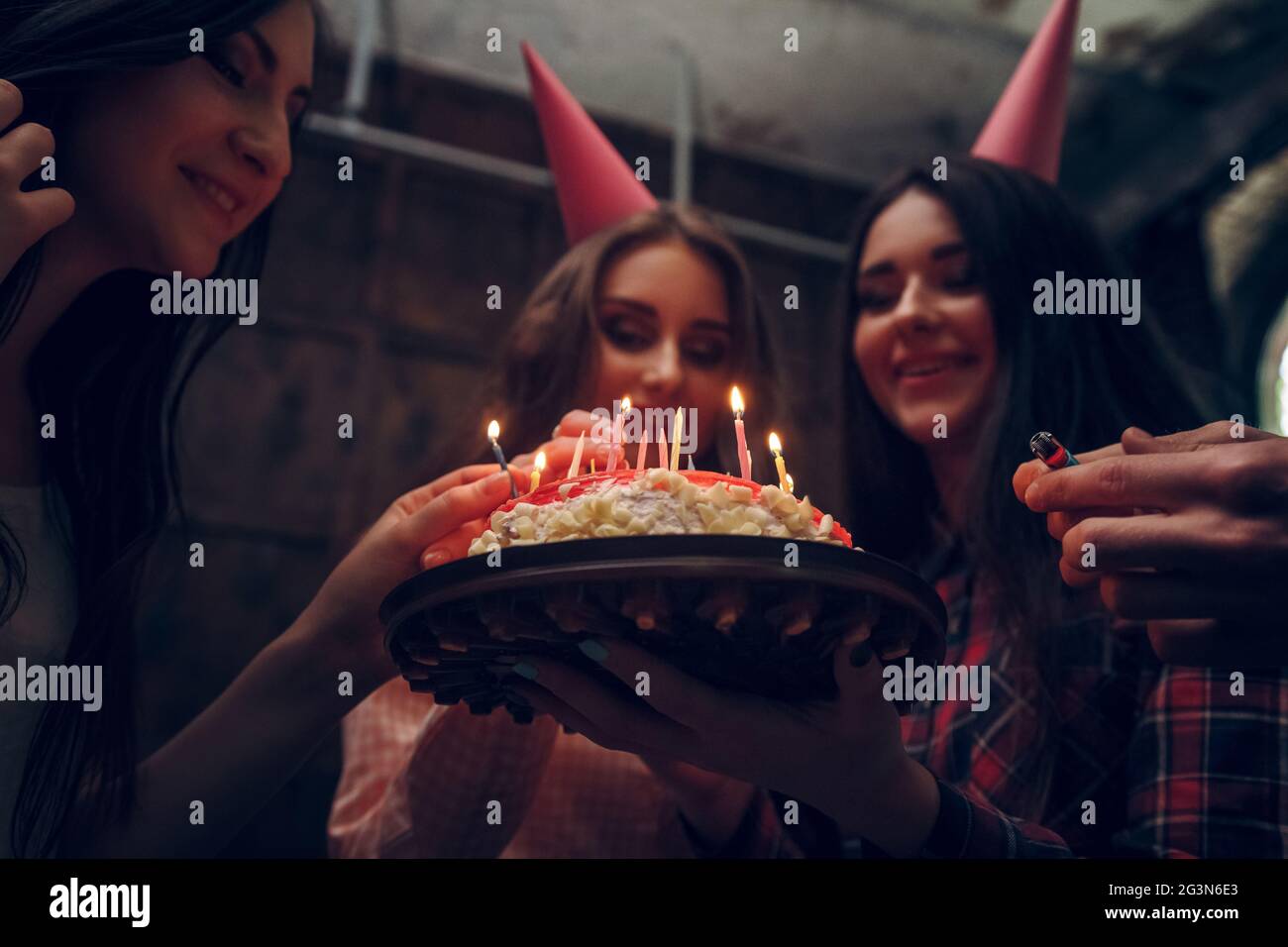 Young woman holding birthday cake Stock Photo - Alamy