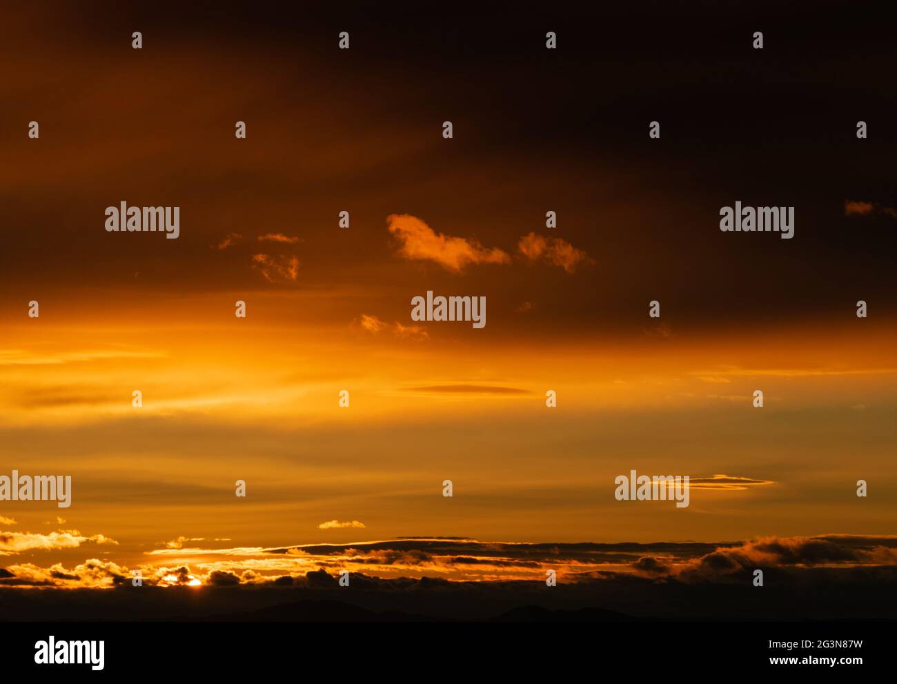 Sunset sky with orange clouds. Nature background Stock Photo - Alamy