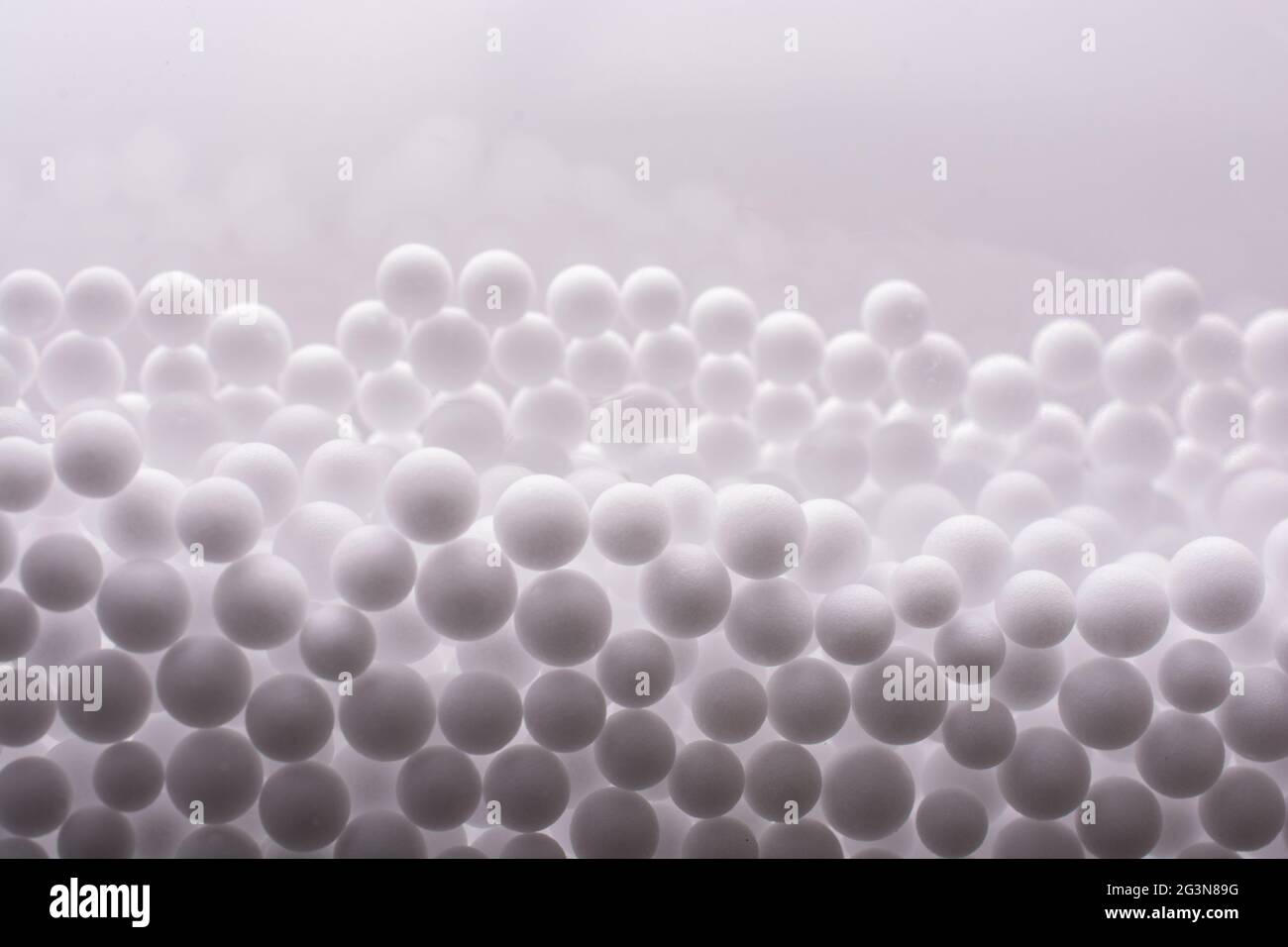 White polystyrene foam balls as background Stock Photo