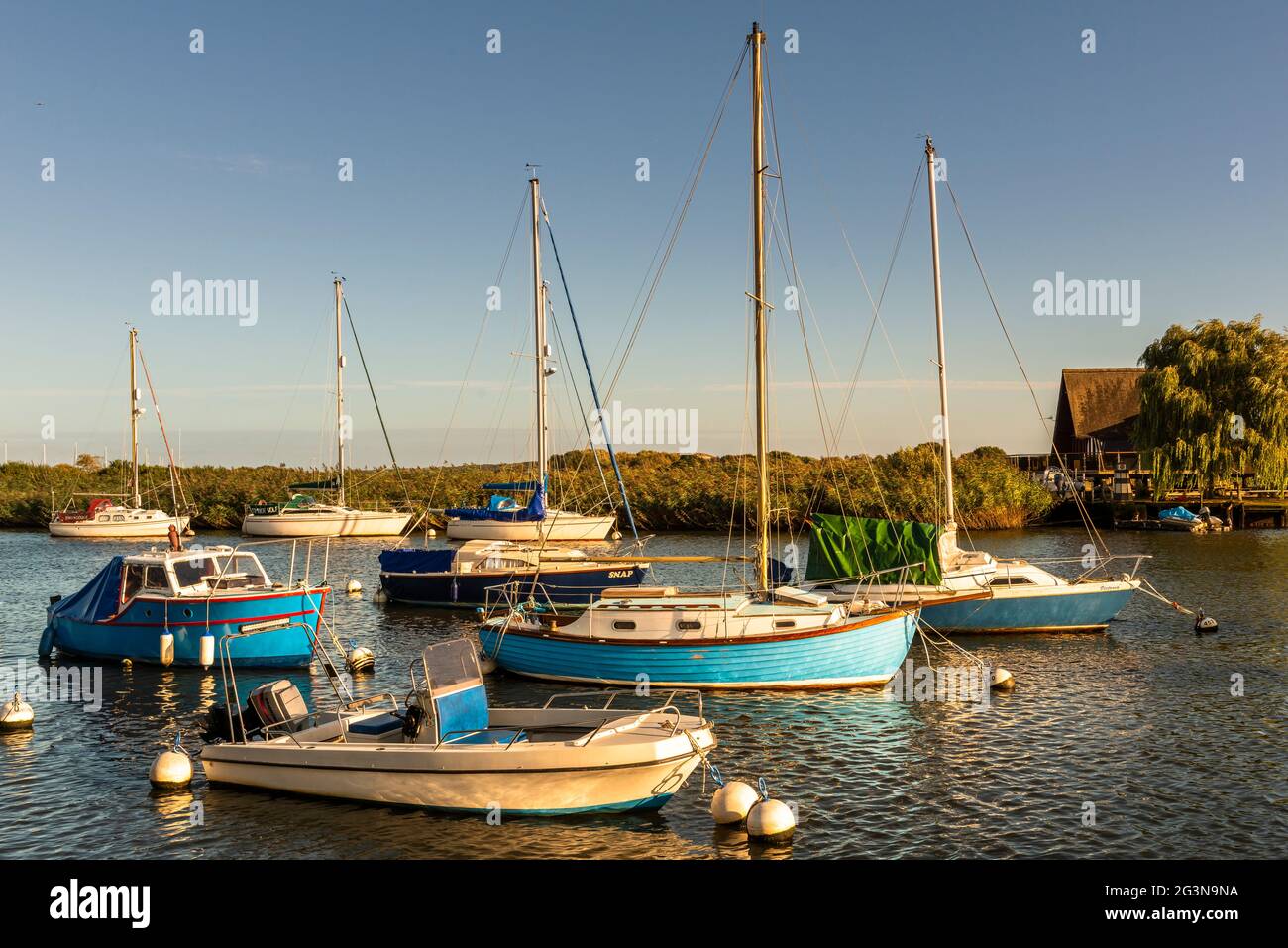 Small yachts moored in Christchurch harbour, Dorset Stock Photo