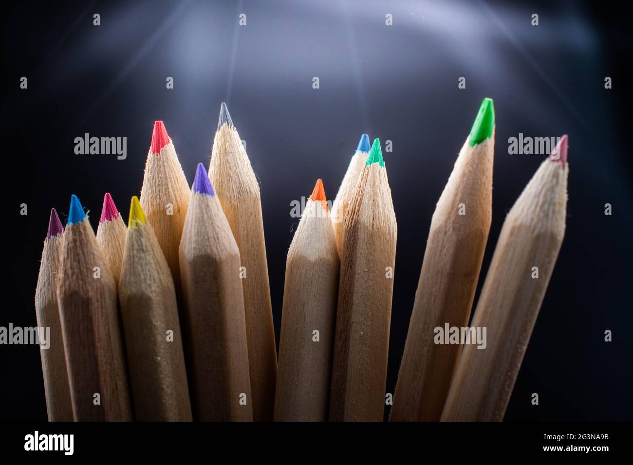 Hand holding colored pencils for creative idea and concept. Stock Photo