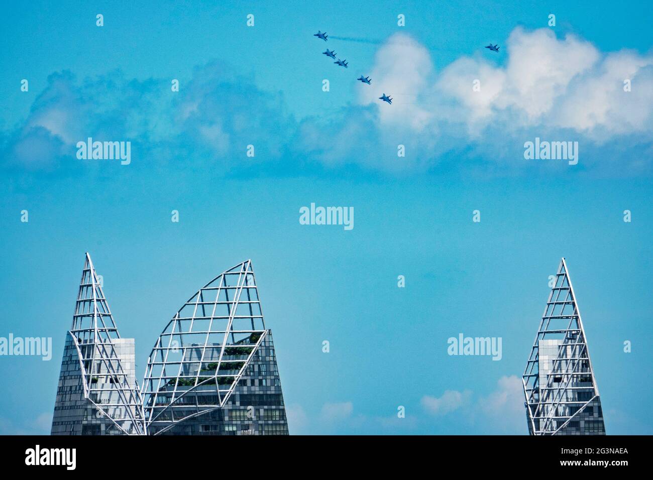 Singapore. 17th June, 2021. Aircrafts fly in formation as part of the rehearsal for the upcoming National Day Parade flying display in Singapore on June 17, 2021. Singapore celebrates its independence day every year on Aug. 9. Credit: Then Chih Wey/Xinhua/Alamy Live News Stock Photo