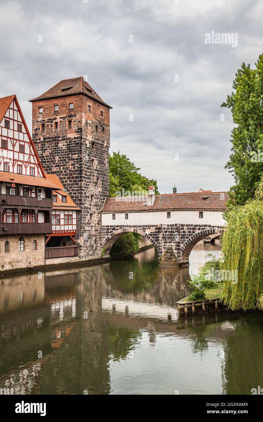 Maxbrucke bridge over Pegnitz river and Henkerturm tower in Nuremberg, Germany Stock Photo
