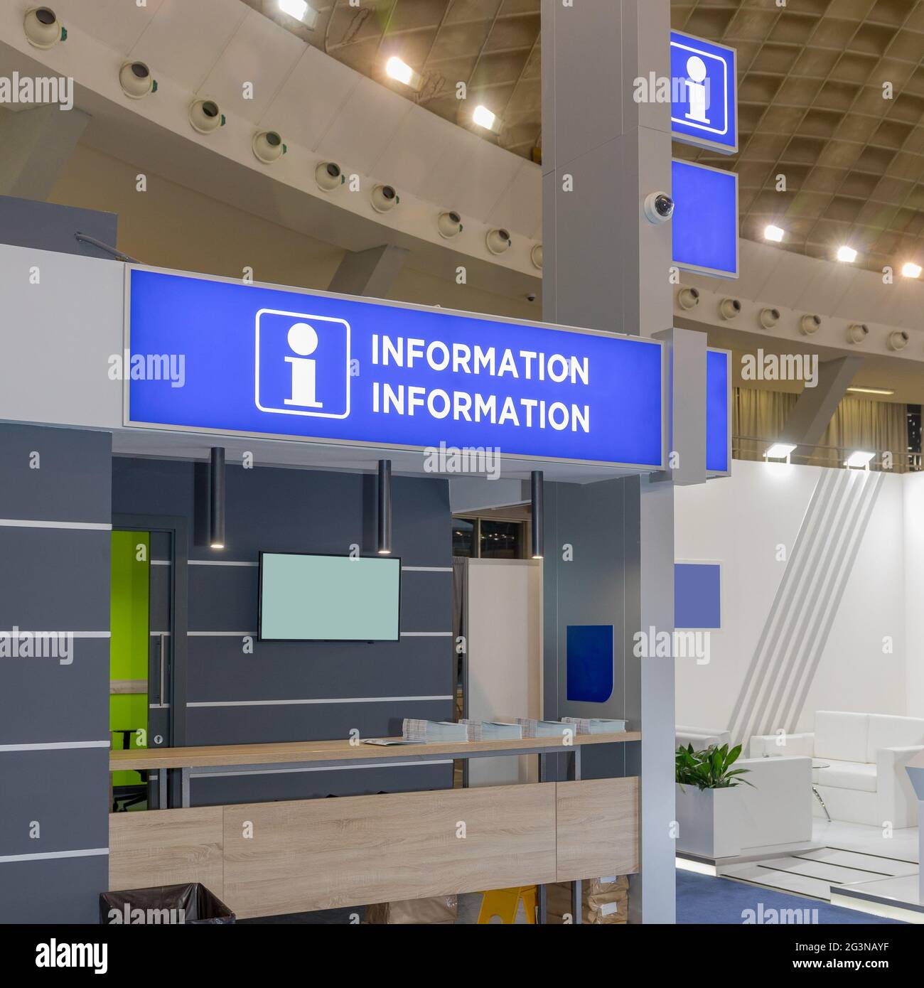 Information Kiosk Booth in Big Expo Fair Hall Stock Photo