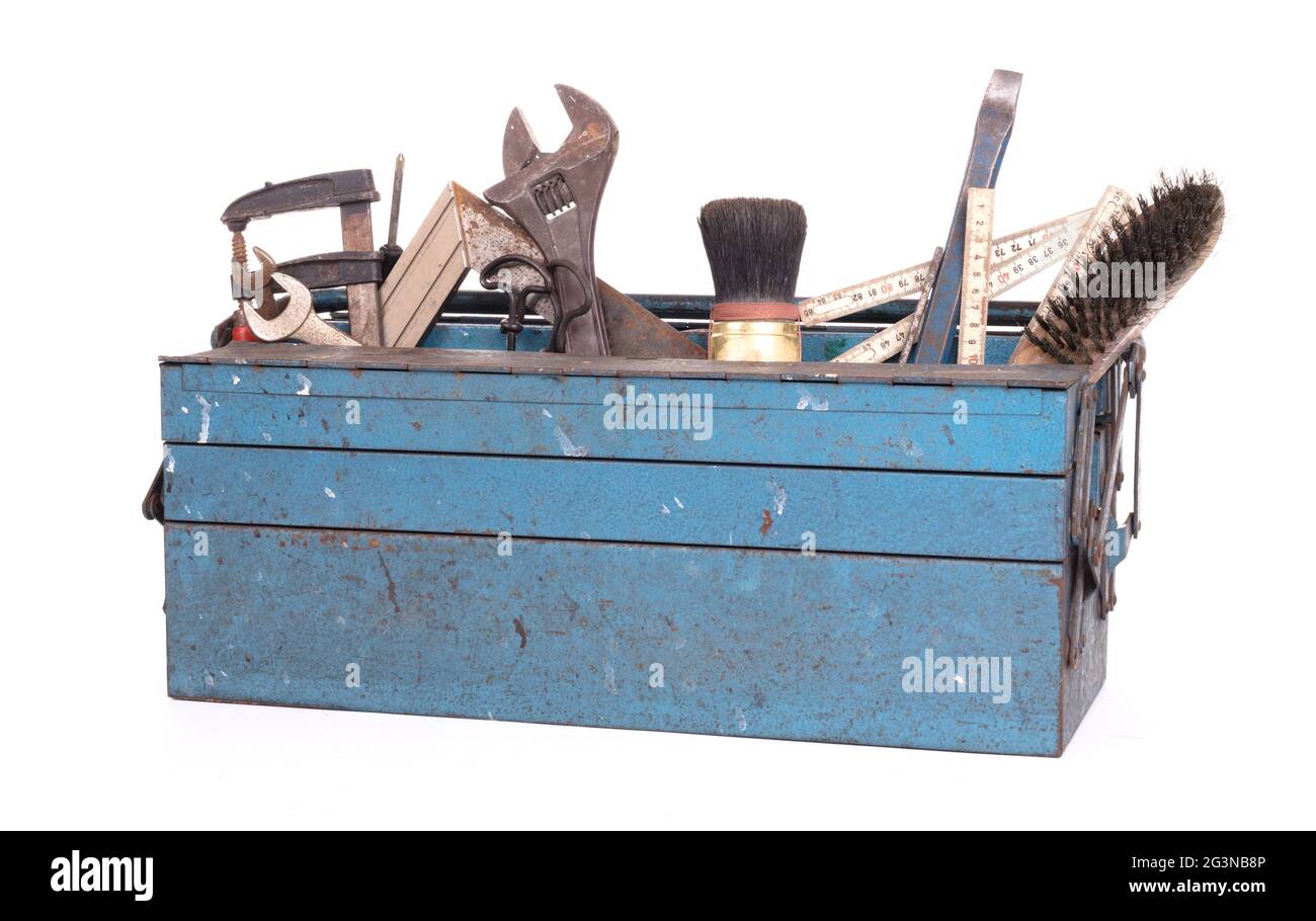 Old toolbox filled with vintage tools Stock Photo