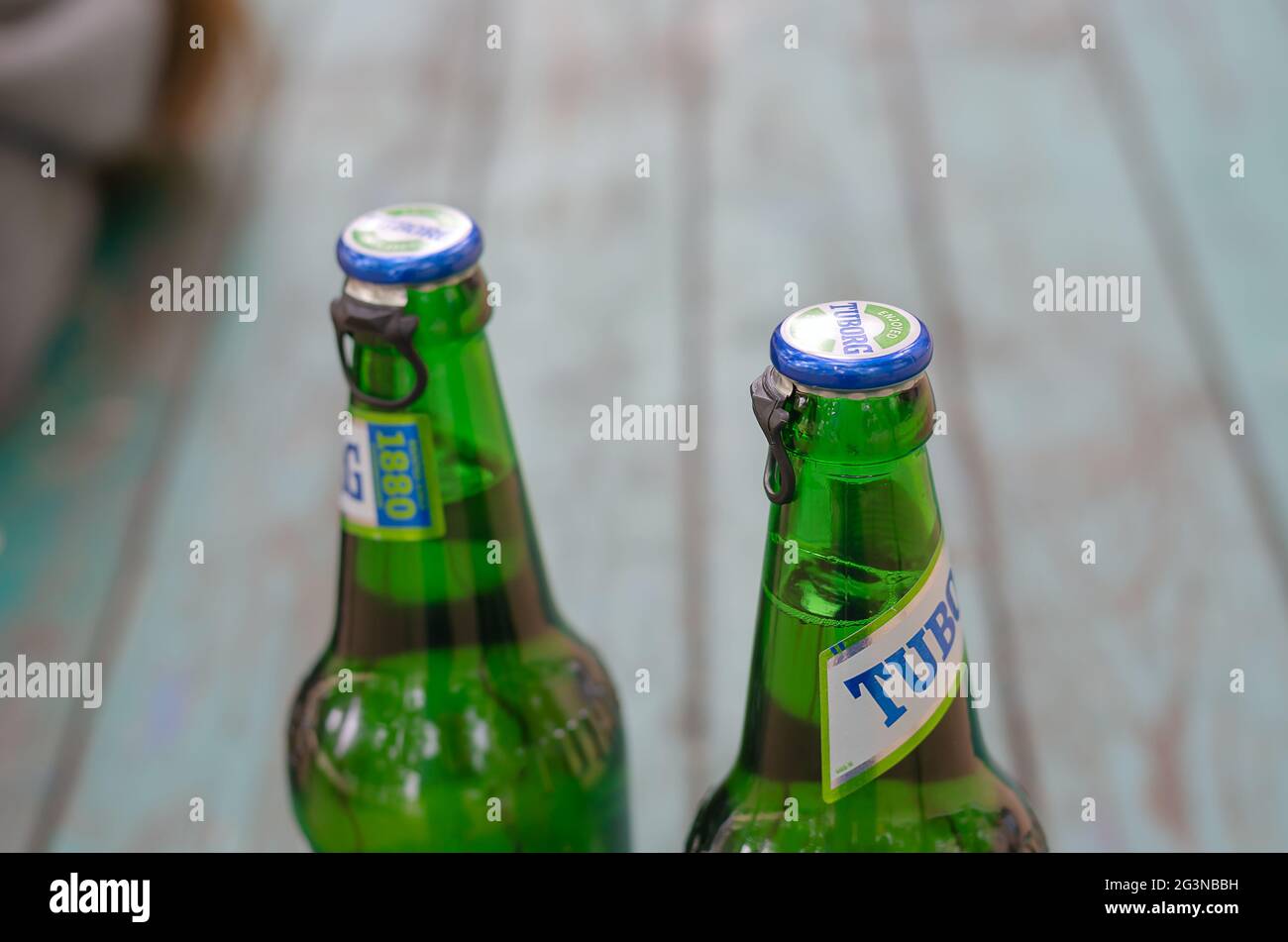 Two beers Tuborg Green close-up. Full beer bottles of the famous lager beer. Nikolaev, Ukraine - April 16, 2021 Stock Photo