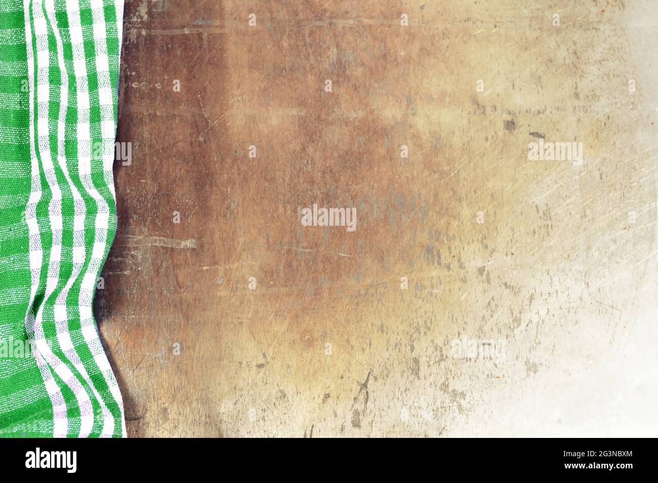 Green checkered tablecloth on grunge background Stock Photo