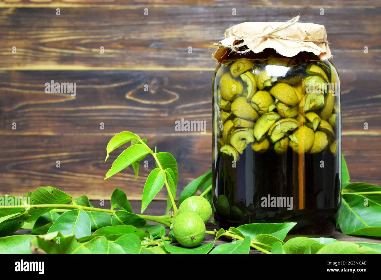 Preparing walnut liqueur. Nocino liqueur Stock Photo