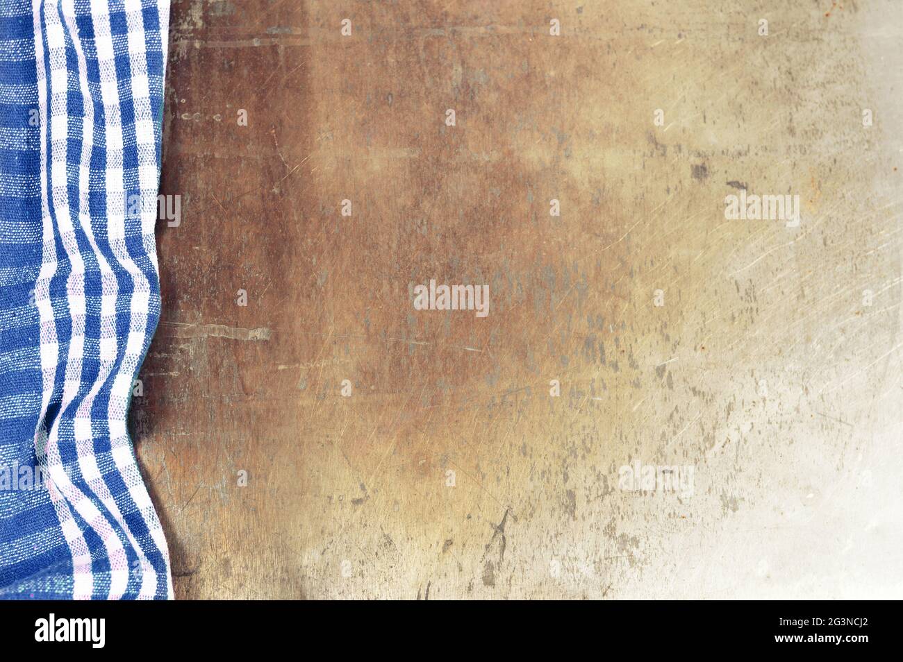 Blue checkered tablecloth on grunge background Stock Photo