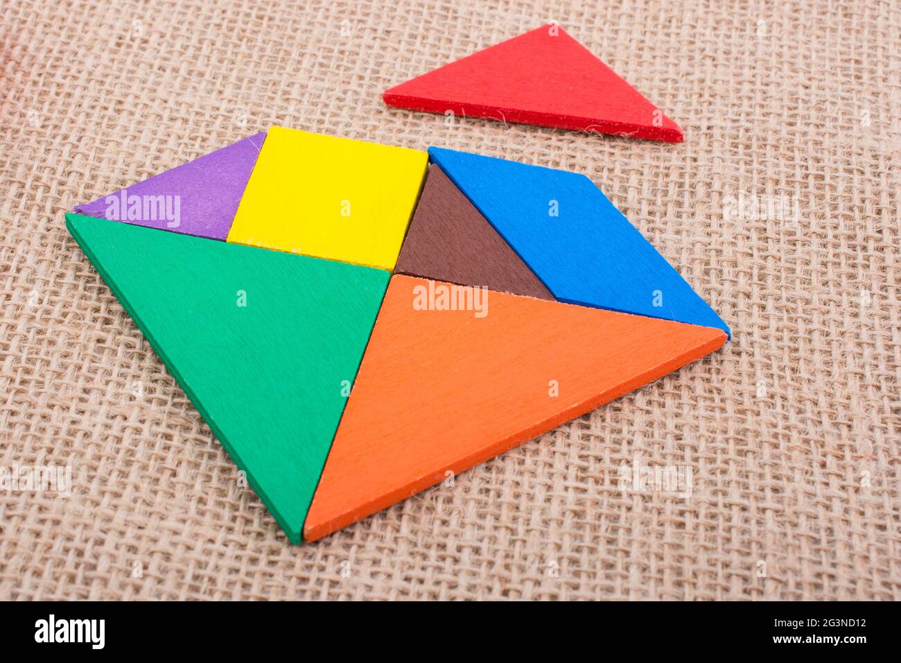 Pieces of a square tangram puzzle Stock Photo
