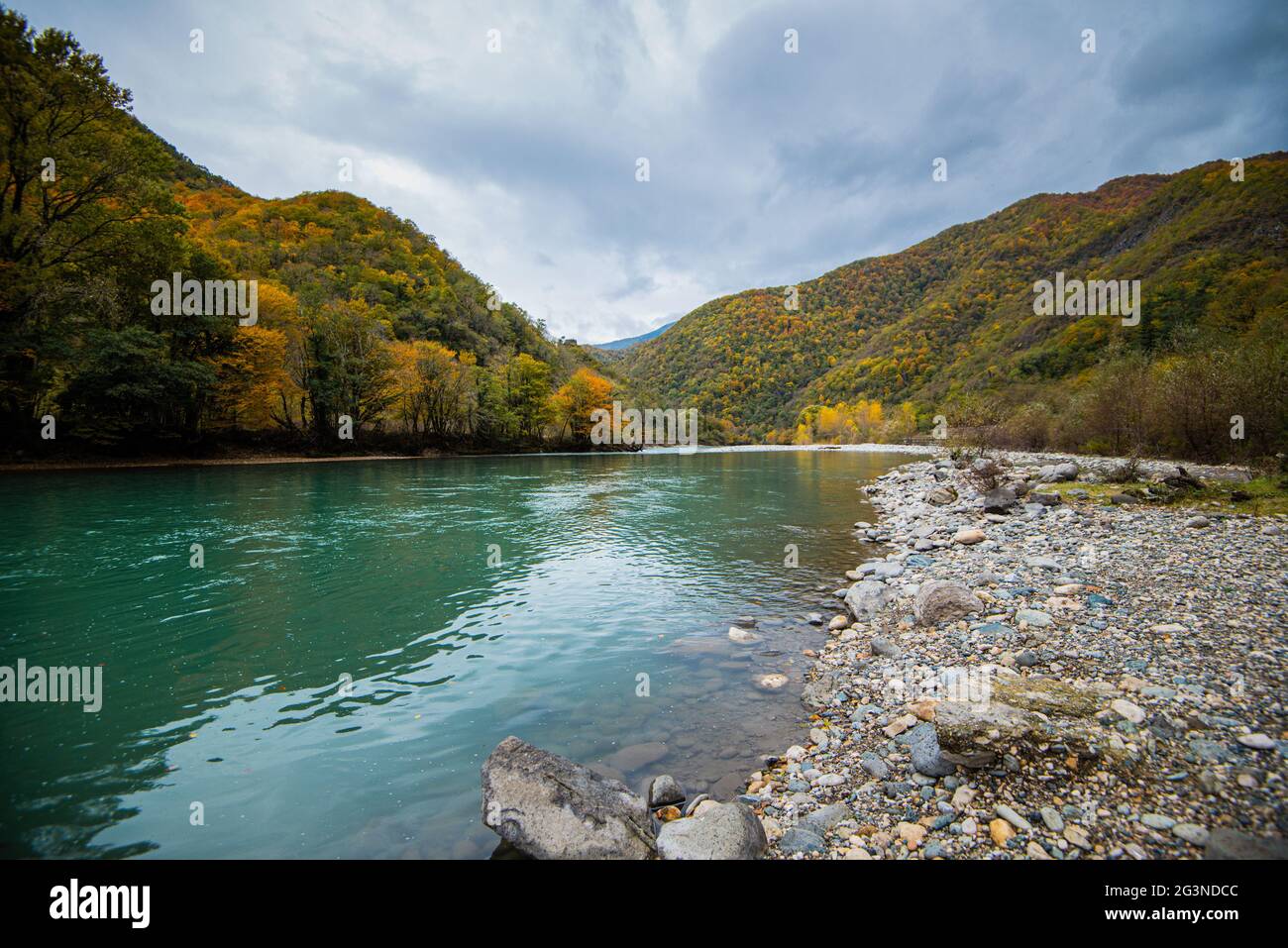 mountain river autumn-winter time period. cloudy weather overcast. landscape. Stock Photo