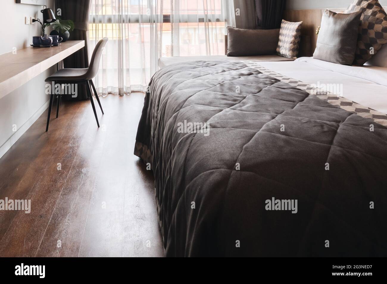 black and grey modern bedroom interior Stock Photo - Alamy