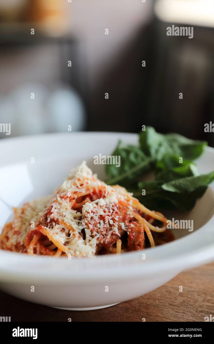 spaghetti Bolognese with italian sausage and tomato sauce with parmesan