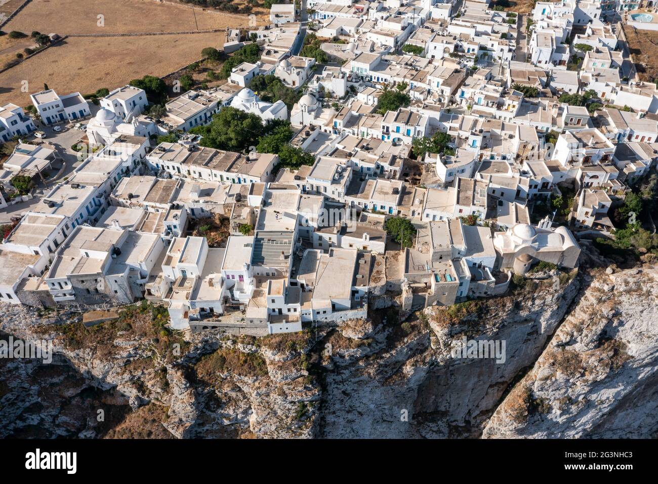 Folegandros island, Greece, Cyclades. Chora village aerial drone view. Traditional Cycladic architecture, whitewashed buildings on top of steep cliffs Stock Photo