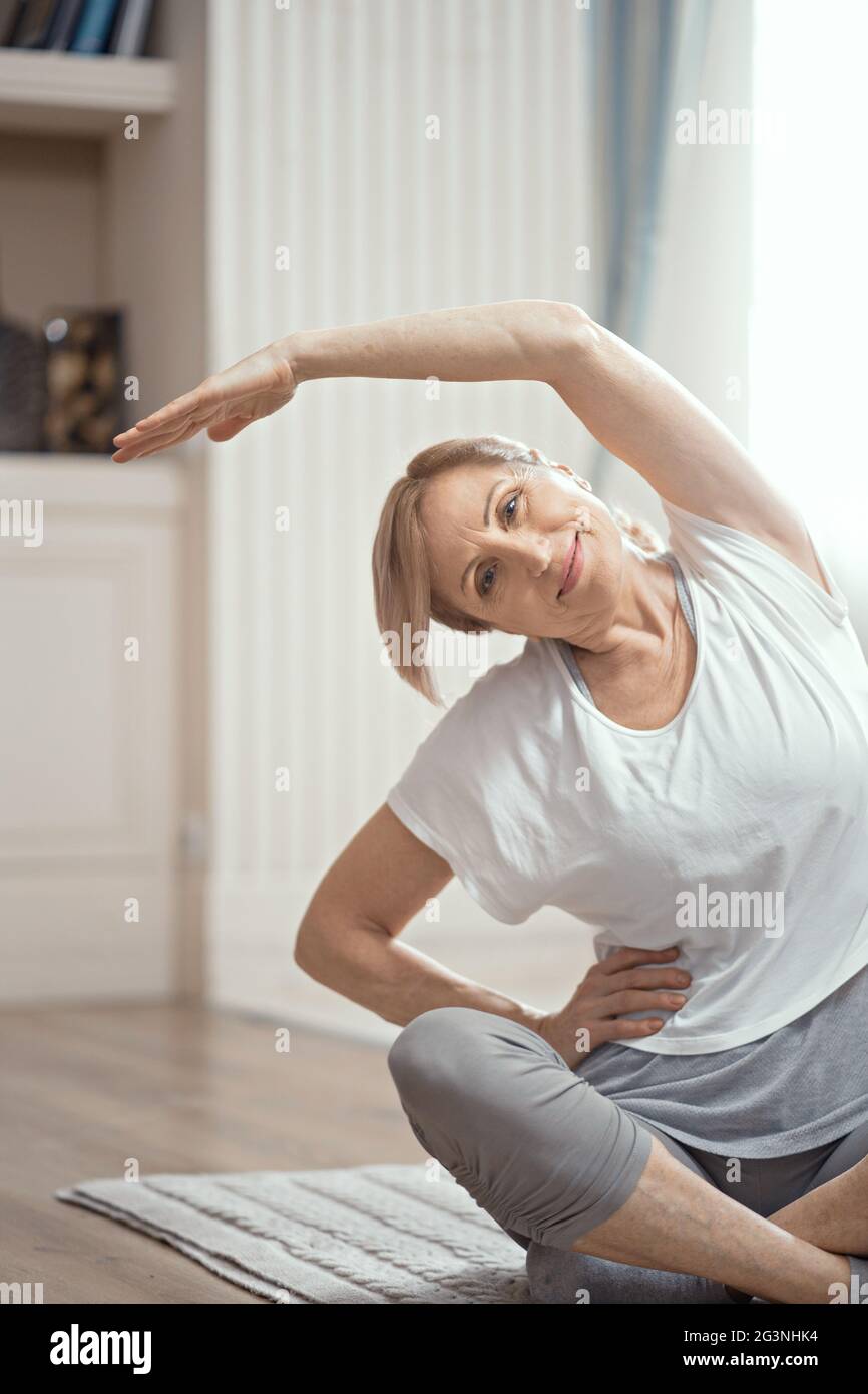 Beautiful fit mature woman sitting hi-res stock photography and images ...