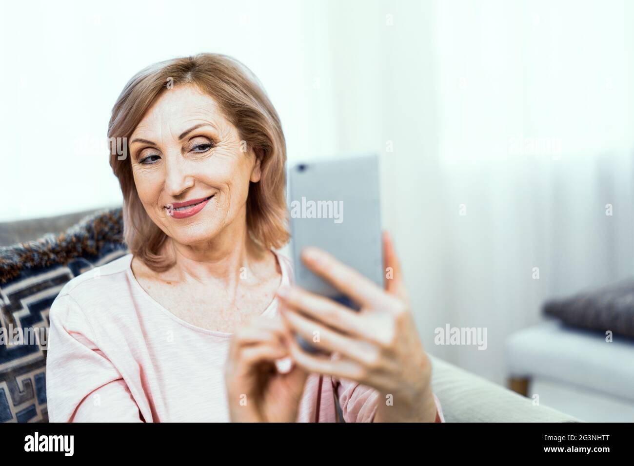 Beautiful Mature Woman Takes Selfie At Home Stock Photo Alamy