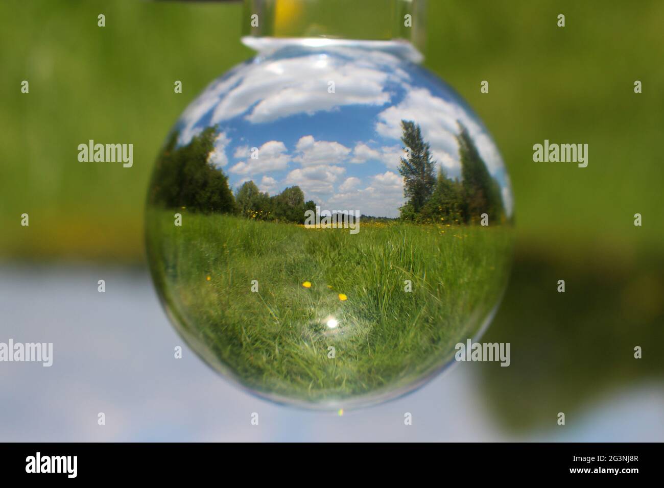 Lens ball in field Stock Photo