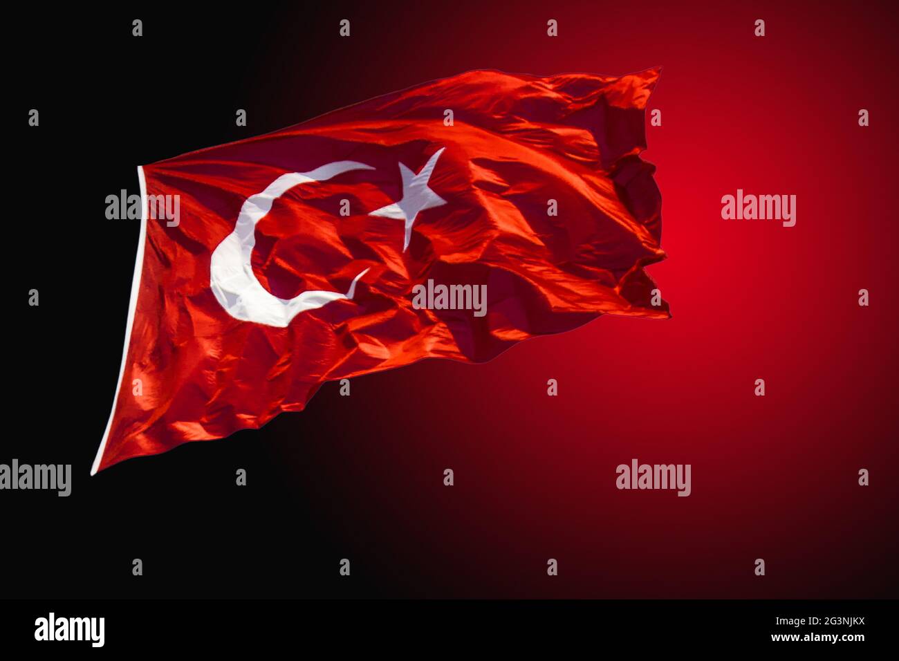 Turkish national flag with white star and moon in view Stock Photo