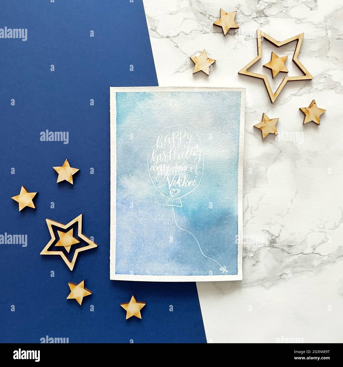 Happy Birthday Card with calligraphy style on blue watercolor background Stock Photo
