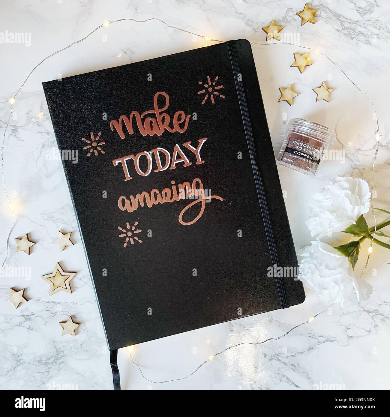 Make Today Amazing Copper calligraphy with hot embossing technique on notebook cover Stock