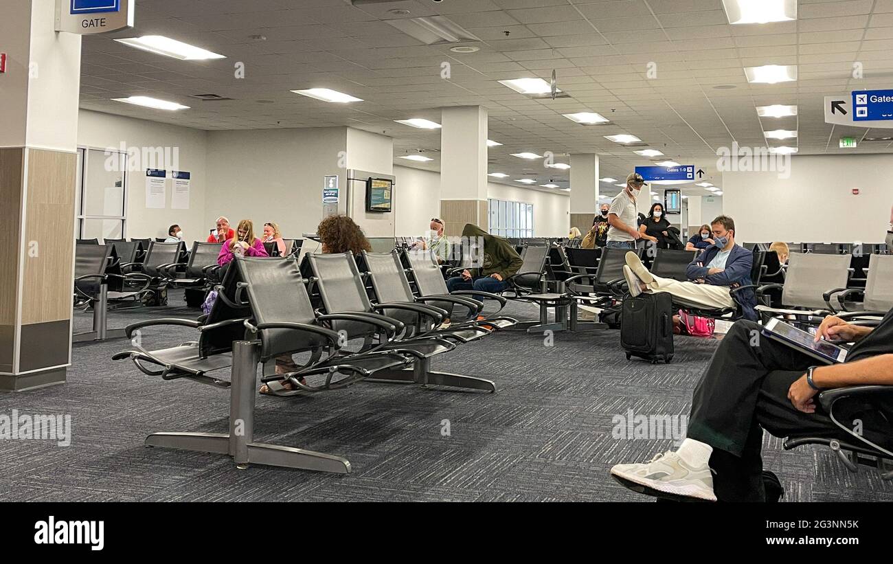Sanford, FL USA May 13, 2021 People waiting in the gate area to